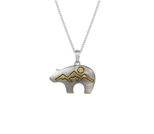 This handmade sterling silver Fetish necklace featuring a mountain landscape etched 10k yellow gol inside of a bear silhouette. From the locally made Teton Jewelry Collection. Comes with chain.