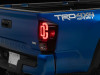 Raxiom 16-23 Toyota Tacoma XW Series Sequential LED Tail Lights- Black Housing- Red Lens - TT30332 Photo - Primary