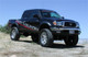 Tuff Country 95-04 Toyota Tacoma 4x4 & PreRunner 5in Lift Kit (No Shocks) - 54900 Photo - Mounted