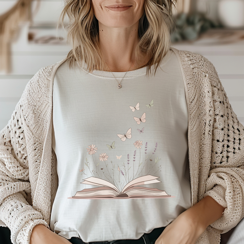 A soft, symbolic tee for readers, writers, and daydreamers. Featuring a delicate butterfly motif, it’s perfect for book lovers growing their own story.