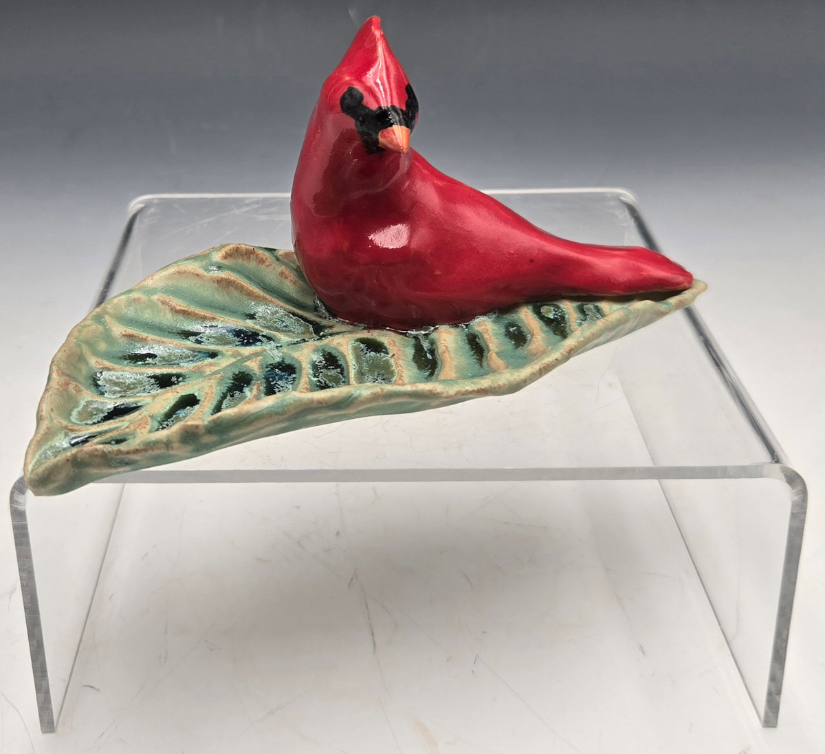 Cardinal with Leaf