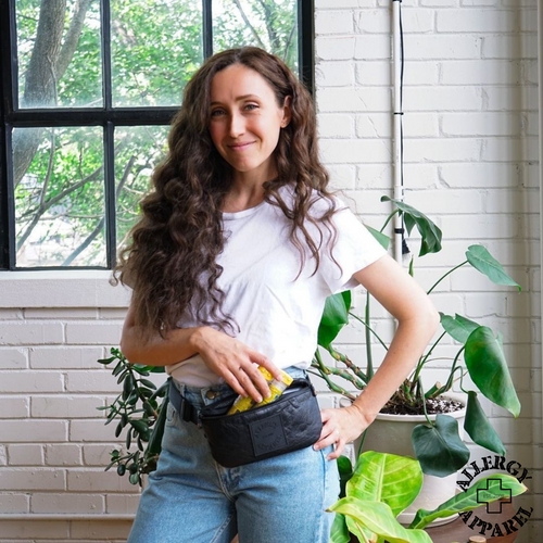 woman wearing the black allergy apparel everyear belt bag around her waist,showing 2 epipens