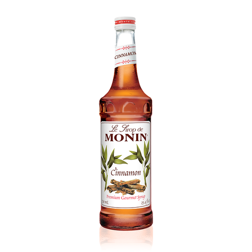 A 750 mL (25.4 fl oz) bottle of Monin Cinnamon Premium Gourmet Syrup. The amber-colored syrup is visible through the bottle, which features a white label with the Monin logo and botanical illustrations of cinnamon sticks and green leaves. The label includes the text "Cinnamon" and "Premium Gourmet Syrup."