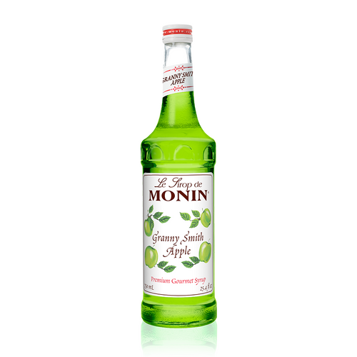 A 750 mL (25.4 fl oz) bottle of Monin Granny Smith Apple Premium Gourmet Syrup. The bright green syrup is visible through the bottle, which features a white label with the Monin logo and illustrations of green Granny Smith apples on leafy branches. The label includes the text "Granny Smith Apple" and "Premium Gourmet Syrup."