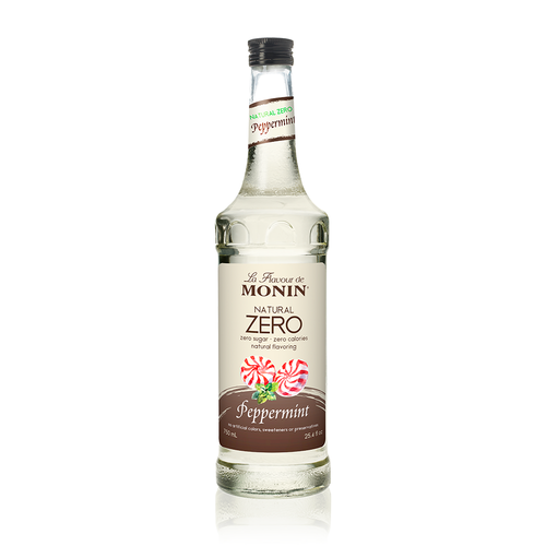 A 750 mL (25.4 fl oz) glass bottle of Monin Natural Zero Peppermint flavoring. The clear liquid is visible through the bottle, which features a cream-colored label. The label includes the Monin logo, "Natural Zero" text indicating zero sugar and zero calories, and an illustration of two red-and-white striped peppermint candies with a small sprig of mint. A secondary label on the neck reads "Natural Zero Peppermint."