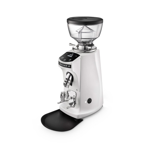 A front perspective of a Mazzer white electronic espresso grinder. The unit includes a clear bean hopper, a digital display panel with touch controls, a silver dosing chute, and an adjustable portafilter holder. The grinder is positioned on a black drip tray against a white background.