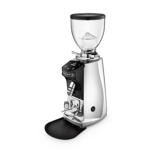 A front perspective of a Mazzer polished silver electronic espresso grinder. The professional grinder features a high-shine chrome finish, a clear bean hopper with a black lid, and a digital touch-control display for precise dosing. It includes a silver coffee grounds chute, an adjustable portafilter holder, and a black grounds tray at the base.