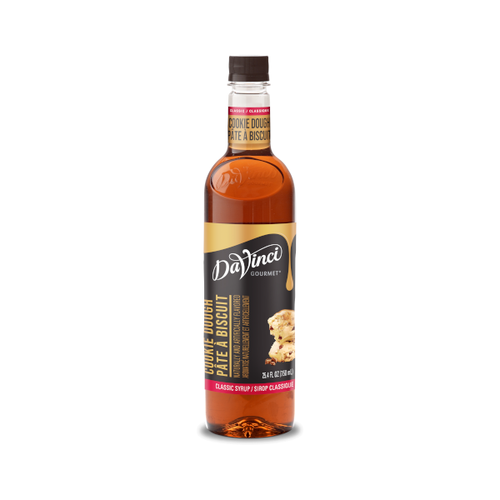 A 25.4 FL OZ (750 mL) glass bottle of DaVinci Gourmet Classic Cookie Dough Syrup. The bottle contains amber-colored syrup with a dark cap and a gold-and-red neck label reading "Cookie Dough / Pâte À Biscuit". Its black main label features script branding above vertical text reading "Cookie Dough / Pâte À Biscuit," a red bottom strip reading "Classic Syrup / Sirop Classique," and an illustration of chocolate chip cookie dough scoops with chocolate bits.