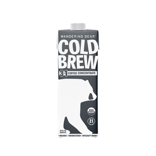 A 32 FL OZ (946 ml) carton of Wandering Bear Cold Brew 3-to-1 Coffee Concentrate. The dark grey carton features bold white text at the top reading "WANDERING BEAR COLD BREW 3 TO 1 COFFEE CONCENTRATE" above a large white silhouette of a bear. The bottom section displays a USDA Organic logo, a circular callout reading "MAKES 21 SERVINGS," and text stating "ORGANIC • UNSWEETENED • SPECIALTY GRADE".
