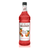 A 1-liter (33.8 fl oz) bottle of Monin Blood Orange Premium Gourmet Syrup. The bright red syrup is visible through the bottle, which features a white label with the Monin logo and illustrations of whole and sliced blood oranges with green leaves. The label includes the text "Blood Orange" and "Premium Gourmet Syrup."