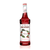 A 750 mL (25.4 fl oz) bottle of Monin Cherry Premium Gourmet Syrup. The deep red syrup is visible through the bottle, which features a white label with the Monin logo and botanical illustrations of clusters of ripe red cherries and green leaves on a branch. The label includes the text "Cherry" and "Premium Gourmet Syrup."