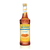 A 750 mL (25.4 fl oz) bottle of Monin Sugar Free Caramel Gourmet Syrup. The amber-colored syrup is visible through the bottle, which features a yellow label with the Monin logo and a blue "Sugar Free" banner. The label includes an illustration of caramel candies and the text "Sugar Free, Calorie Free Gourmet Syrup."
