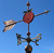 Peach painted weathervane