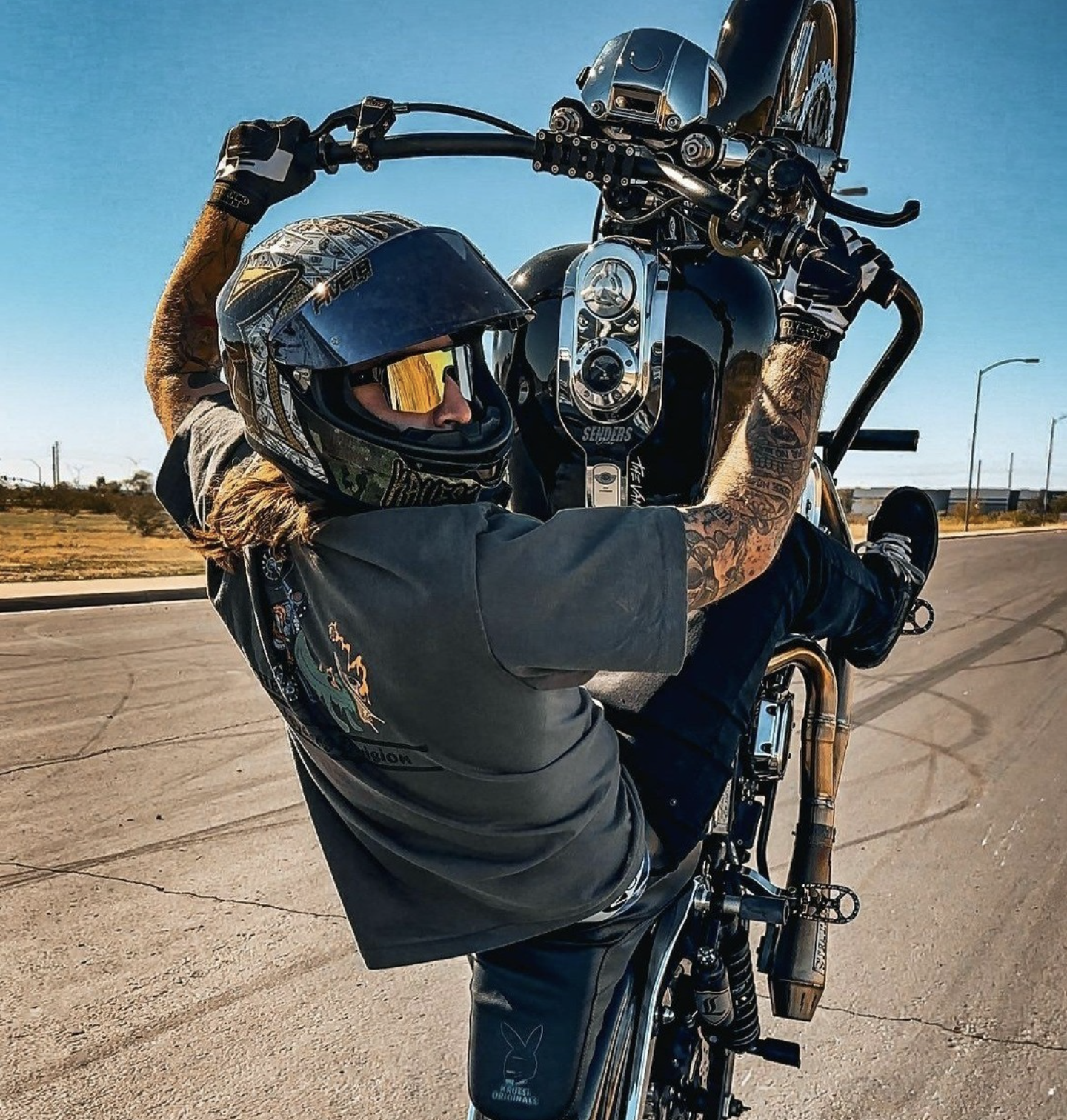 Rider pulling a wheelie in Flight Eyewear Accelerator sunglasses with gold lens