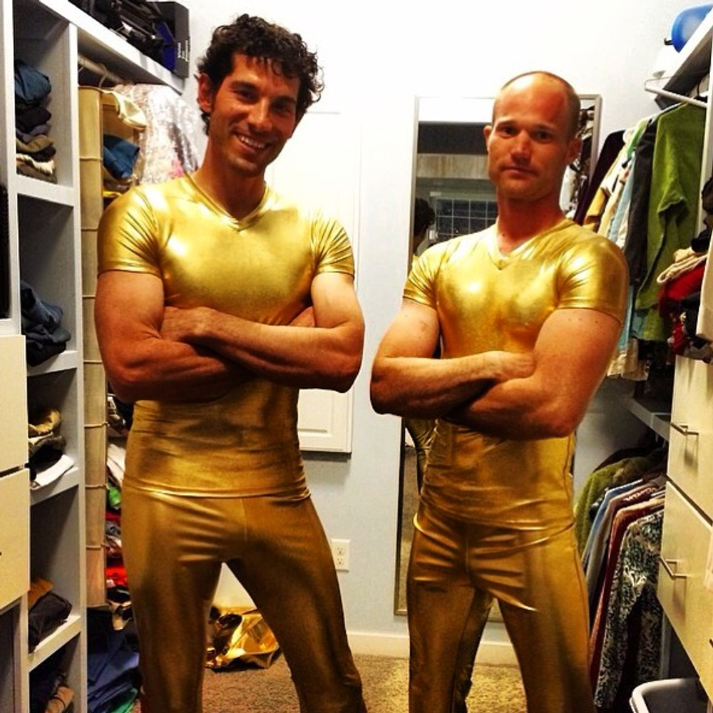 American Ninja Warriors wearing Suzi Fox gold shirts and pants!
Mens pants shown in Gold Metallic Foil coated Spandex, custom made by Suzi Fox.
Custom made to your measurements!
• Available in gold, silver, copper, gunmetal, turquoise, Royal blue, red, green, purple, fuchsia, black faux leather/rubber Metallic Foil and any fabric on this site.
• 1 inch no-roll elastic at the waist.
• Optional 1 or 2-slider crotch zipper.
• Choose your ankle size - tight ankles, jean cut, boot cut, or bellbottom.
• Optional ankle zippers.
• Optional belt loops.
• Optional rear patch pockets.
Made in the U.S.A.