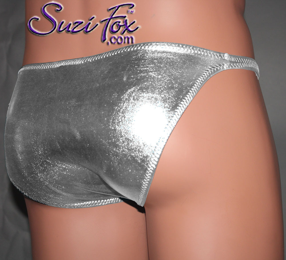Men's Pouch Front, Wide Strap, Brazilian Bikini - shown in Silver Metallic Foil Spandex, custom made by Suzi Fox.
• Available in gold, silver, copper, gunmetal, turquoise, Royal blue, red, green, purple, fuchsia, black faux leather/rubber Metallic Foil or any fabric on this site.
• Standard front height is 6 inches (15.24 cm).
• Available in 4, 5, 6, 7, 8, 9, and 10 inch front heights.
• Wear it as swimwear OR underwear!
• Made in the U.S.A.
