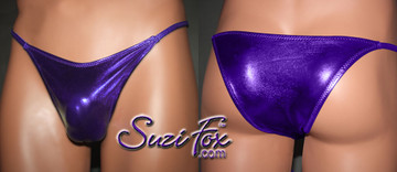 Mens Smooth Front, Skinny Strap, Rio Bikini - shown in Purple Metallic Foil Spandex, custom made by Suzi Fox.
• Available in gold, silver, copper, gunmetal, turquoise, Royal blue, red, green, purple, fuchsia, black faux leather/rubber Metallic Foil or any fabric on this site.
• Standard front height is 7 inches (17.8 cm).
• Available in 4, 5, 6, 7, 8, 9, and 10 inch front heights.
• Wear it as swimwear OR underwear!
• Made in the U.S.A.