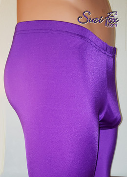 Pouch Front pants shown in Purple Milliskin Tricot Spandex, custom made by Suzi Fox.
• 1 inch elastic at the waist.
• Choose any fabric on this site, including vinyl/PVC, metallic foil, metallic mystique, wetlook lycra Spandex, Milliskin Tricot Spandex.
• Custom sizing available.
• Plus size available.
• Optional rear patch pockets.
• Optional belt loops.
• Optional ankle zippers.
• Worldwide shipping.
• Made in the U.S.A.