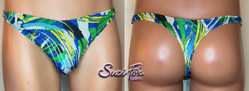 Mens Smooth Front, Wide Strap, T-back Thong- shown in LIMITED EDITION blue, yellow, green print spandex with small metallic circles, custom made by Suzi Fox.
• Pattern is random, no two are alike!
• Standard Front height is 7 inches (17.78 cm).
• Available in 3, 4, 5, 6, 7, 8, 9, and 10 inch front heights.
• Choose your pouch height. Pouch height is measured from behind the scrotum, up the side of the genitals, to the desired top of the suit.
• Lining is optional.
• Wear it as swimwear OR underwear!
• Made in the U.S.A.