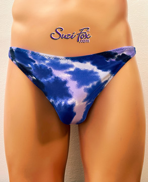 Mens Smooth Front, Wide Strap, T-back Thong- shown in LIMITED EDITION blue tie dye clouds on spandex, custom made by Suzi Fox.