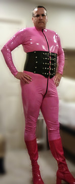 (Customer photo) Mens Catsuit by Suzi Fox shown in Hot Pink Gloss Vinyl/PVC coated Nylon Spandex, by Suzi Fox (customer photo).
• Choose any fabric on this site, including vinyl/PVC, metallic foil, metallic mystique, wetlook lycra Spandex, Milliskin Tricot Spandex.
• Optional Custom Sizing.
• Plus size available.
• Optional 1 or 2 or 3-slider crotch zipper.
• Optional wrist zippers.
• Optional ankle zippers.
• Worldwide shipping.
• Made in the U.S.A.
