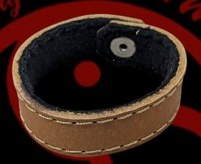 Brown 100% Leather wrist band.
They are fleece lined to be super comfortable and can be worn anywhere.