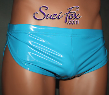 Men's Split Side Running/ Cover-Up Shorts shown in Gloss Turquoise Vinyl/PVC, custom made by Suzi Fox.
• Available in black, white, red, navy blue, royal blue, turquoise, purple, Neon Pink, fuchsia, light pink, matte black (no shine), matte white (no shine), black 3D Prism, red 3D Prism, Turquoise 3D Prism, Baby Blue 3D Prism, Hot Pink 3D Prism, and any fabric on this site.
• 1 inch no-roll elastic at the waist.
• Optional front inside pouch.
• Made in the U.S.A.