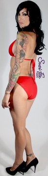 Womens full rear coverage Swim Suit bottom shown in Red Wet Look lycra Spandex, custom made by Suzi Fox.
• Custom made to your measurements.
• Available in black, white, red, turquoise, navy blue, royal blue, hot pink, lime green, green, yellow, steel gray, neon orange Wet Look, and any fabric on this site.
• Top sold separately. (T1 top shown)
• Made in the U.S.A.