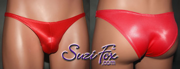 Mens Pouch Front, Wide Strap, Rio Bikini - shown in Red Wetlook Lycra Spandex, custom made by Suzi Fox.
• Available in black, white, red, turquoise, navy blue, royal blue, hot pink, lime green, green, yellow, steel gray, neon orange Wet Look or any fabric on this site.
• Standard front height is 7 inches (17.8 cm).
• Available in 4, 5, 6, 7, 8, 9, and 10 inch front heights.
• Wear it as swimwear OR underwear!
• Made in the U.S.A.