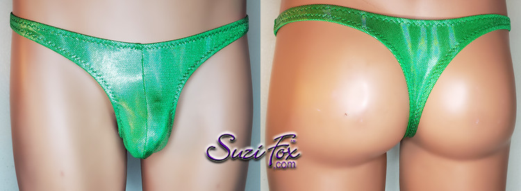 Mens Pouch Front, Wide Strap, T-Back thong in Green Spandex with tiny silver foil dots, custom made by Suzi Fox.
THIS IS ONE OF A KIND! Brand new! Ready to ship!
• Size Medium, Waist 32-35 inches (81.28 cm - 88.9 cm)
• Standard front height is 6 inches (15.24 cm).
• Standard pouch size is 2 inches (5.08 cm).
• Made in the U.S.A.