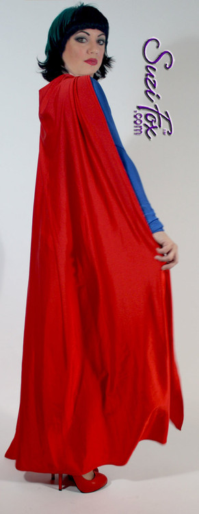 Superhero Cape shown in Red Shiny Milliskin Tricot Nylon Spandex, custom made by Suzi Fox.
You can order this in almost any fabric on this site.
• Available in black, white, red, royal blue, sky blue, turquoise, purple, green, neon green, hunter green, neon pink, neon orange, athletic gold, lemon yellow, steel gray Miilliskin Tricot spandex. This is a 4-way extreme stretch fabric with a slight shine. Light, airy, thin, and very comfortable!
• String tie around the neck.
• Made in the U.S.A.