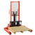 A 1000KG vertical manual hand walkie stacker (model SFH10W) featuring a sturdy steel frame, hydraulic lifting system, and ergonomic handle, designed for efficient pallet handling in warehouses, logistics centers, and industrial environments.
