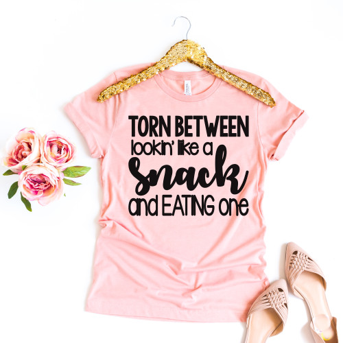 Torn Between Looking Like A Snack Tee Black Ink