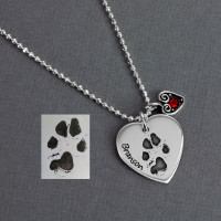 Custom silver heart necklace personalized with pet's actual paw print & name, engraved on a sterling silver heart charm, shown with silver Heart Swirl Charm with Birthstone and the original pawprint