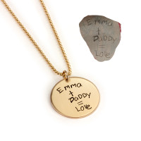 Custom gold disc handwriting necklace, personalized with daughter's handwritten note, shown on white with original handwritten note