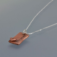 Hand Stamped Loved Copper Rectangle Necklace, close up from the side