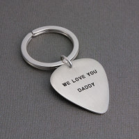 Father's Day gift of sterling silver hand stamped guitar pick key chain with message from the kids, shown from the side