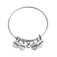 Personalized adjustable silver bracelet with hand stamped charms featuring kids' names, shown on white