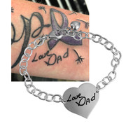 Tattoo image on custom heart silver handwriting bracelet, shown with original tattoo
