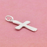 Sterling silver cross charm pendant, shown from the side