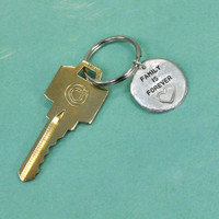 Hand stamped heart key chain with key, saying Family is Forever