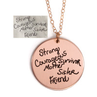 Custom rose gold disc handwriting necklace, personalized with kids' handwritten words describing their mom, shown close up on white