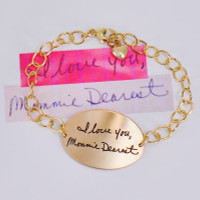 Gold memorial bracelet with your loved ones' actual handwriting, shown with original handwritten note used to personalize it