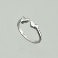 Handmade silver ring with two hearts, shown from the top
