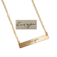 Gold bar necklace with husband's handwritten "Love You" to wife. Shown with the original handwriting used to personalize it