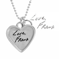Large silver heart handwriting necklace with keys to your heart, with original writing saying Love Frank, shown close up on white