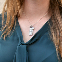 Established family necklace heirloom from silver rectangle, shown on a model