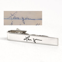Custom silver tie clip with actual handwriting and the handwriting sample used to personalize it