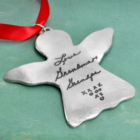 Handwriting Angel Ornament in fine pewter, personalized with your loved one's actual handwriting, with red ribbon, shown close up on green