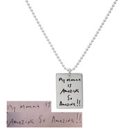 Custom silver necklace with handwritten note on sterling rectangle tag, shown with original handwriting used to personalize it